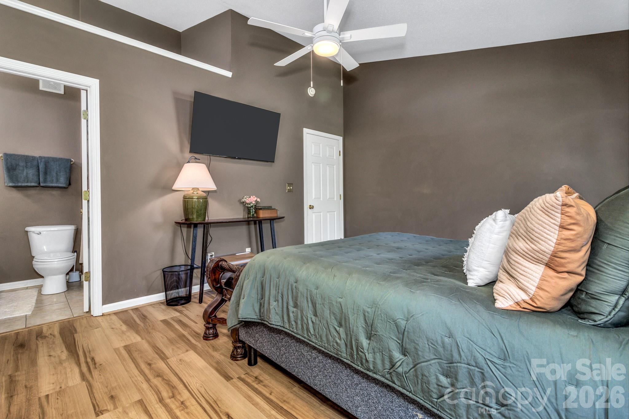 58 South Sunberry Trail Fletcher, NC 28732 - Photo 25 of 41 a bedroom with a bed and a chandelier