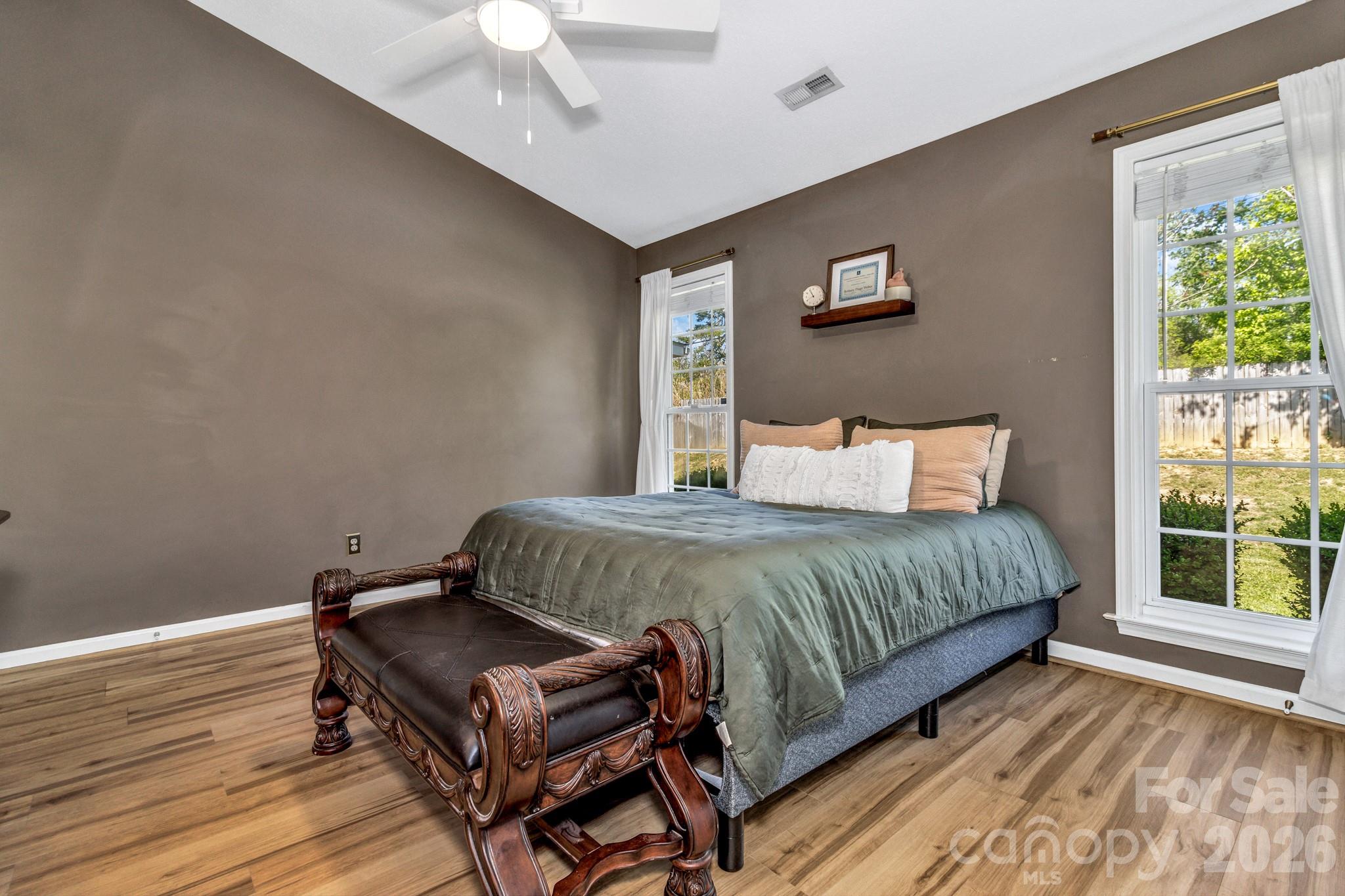 58 South Sunberry Trail Fletcher, NC 28732 - Photo 26 of 41 a bedroom with a bed window and wooden floor