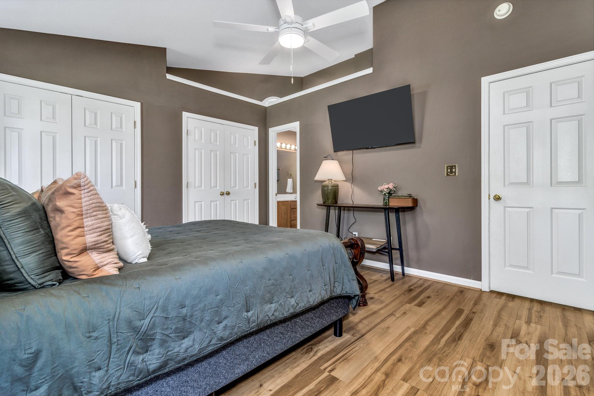 58 South Sunberry Trail Fletcher, NC 28732 - Photo 27 of 41 a bedroom with a bed and a flat screen tv