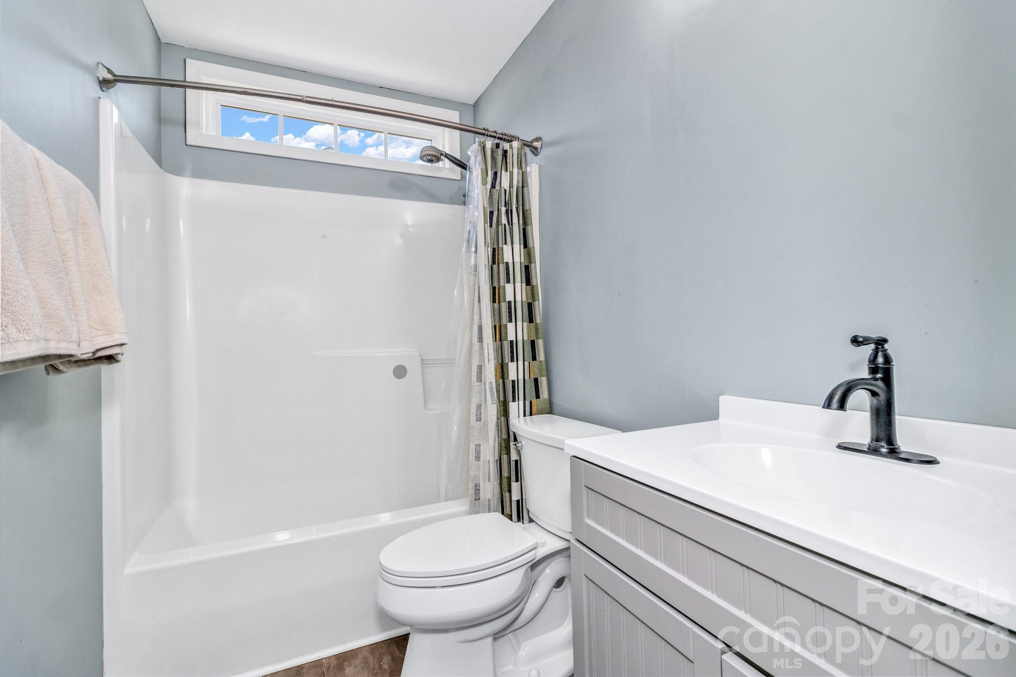 58 South Sunberry Trail Fletcher, NC 28732 - Photo 30 of 41 a bathroom with a sink a toilet and shower