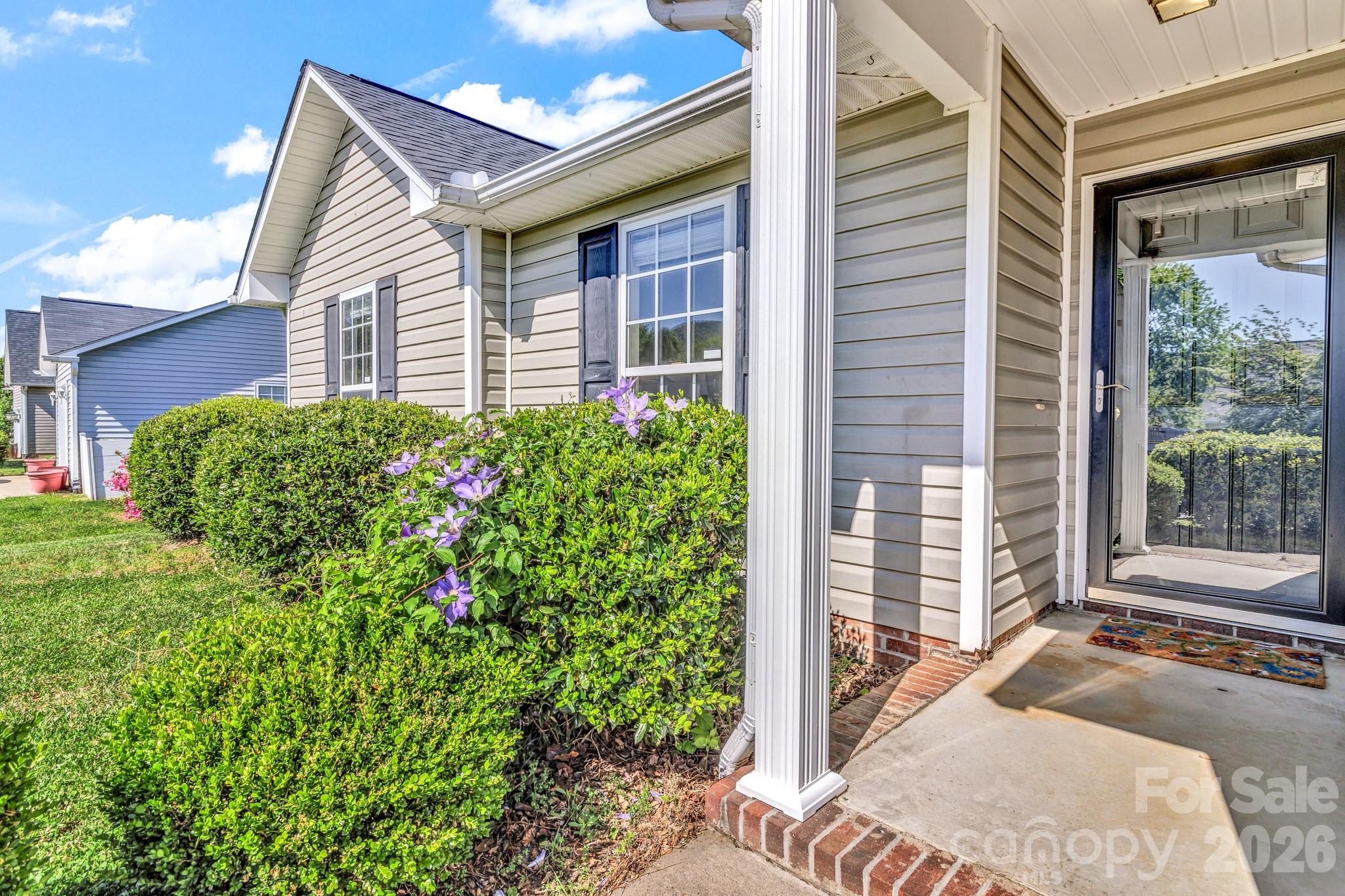 58 South Sunberry Trail Fletcher, NC 28732 - Photo 5 of 41 a house view with a garden space