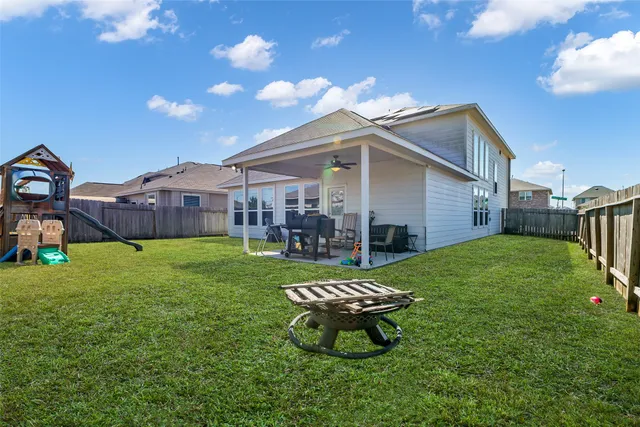 a swimming pool with some trees in the background