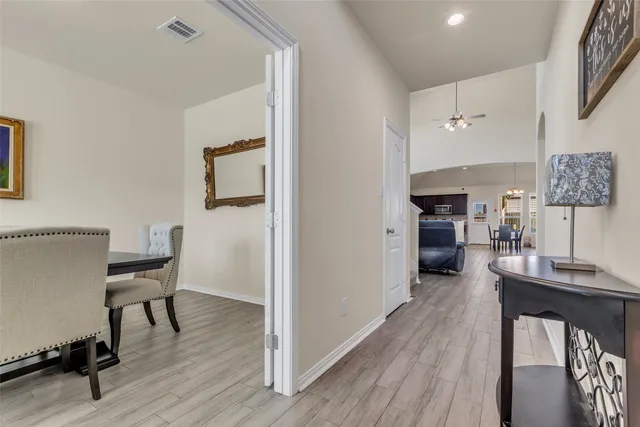 a view of a dining room with furniture and wooden floor