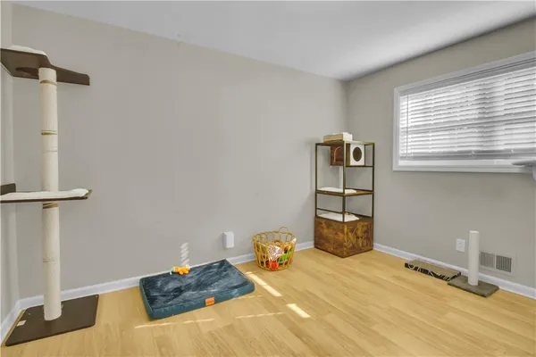 a bedroom with a bed and dresser