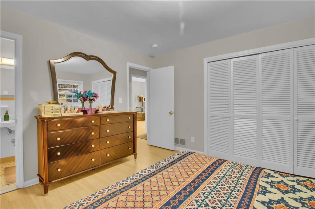 3155 Hogan Road Southwest Atlanta, GA 30331 - Photo 14 of 15 a bedroom with a bed and a dresser