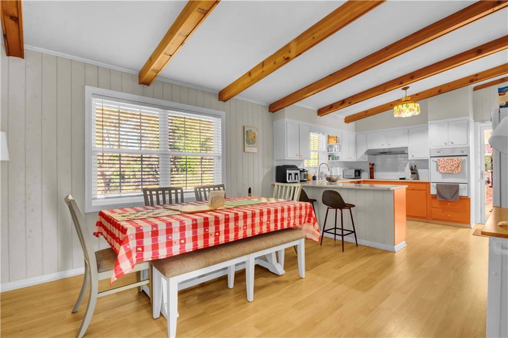 3155 Hogan Road Southwest Atlanta, GA 30331 - Photo 7 of 15 a dining room with a wooden table and chairs