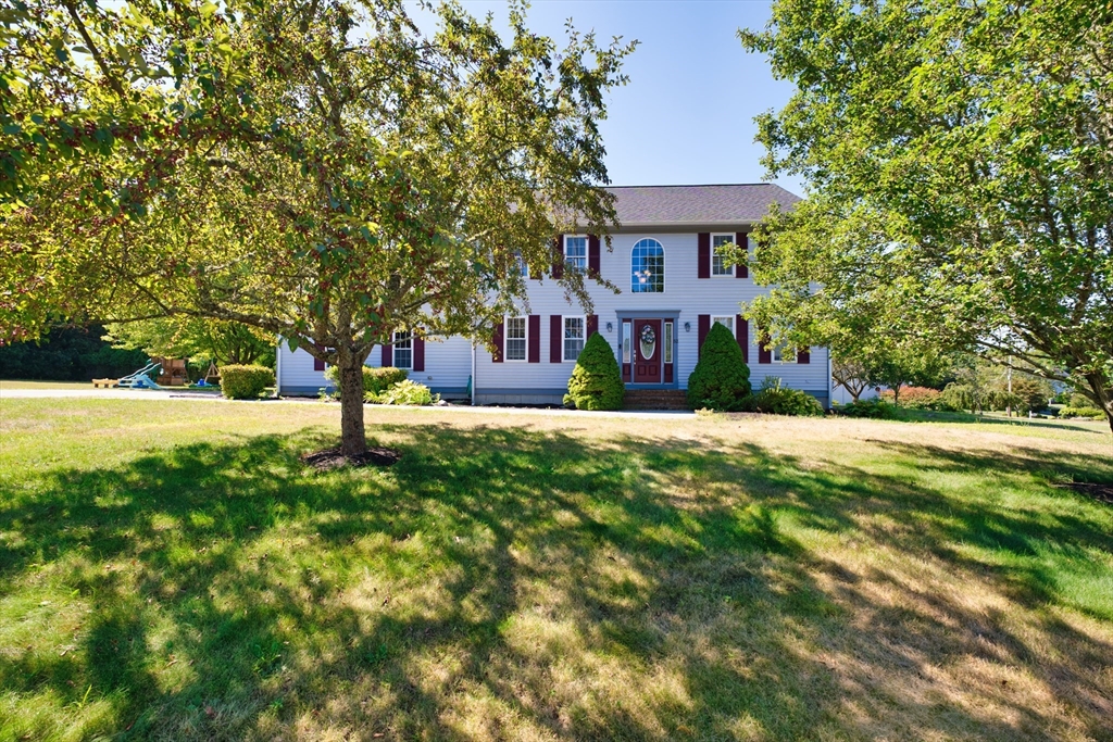 a front view of a house with a yard