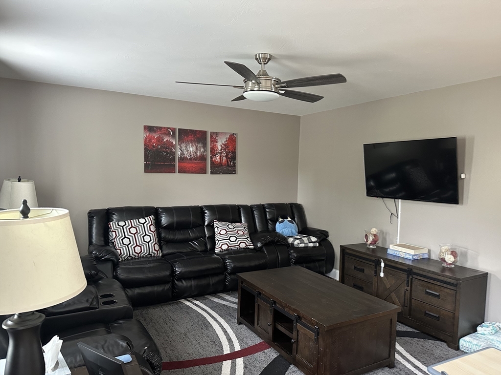52 Pershing Avenue Acushnet, MA 02743 - Photo 11 of 27 a living room with furniture and a flat screen tv