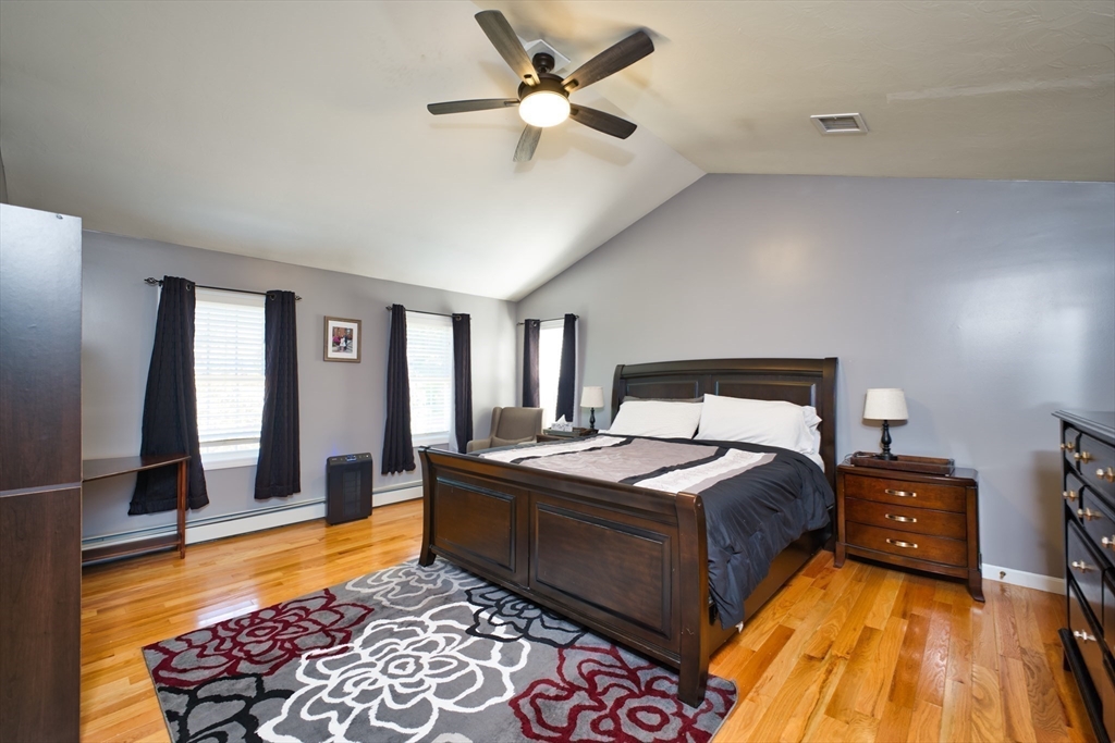 52 Pershing Avenue Acushnet, MA 02743 - Photo 13 of 27 a bed room with a bed and a lamp