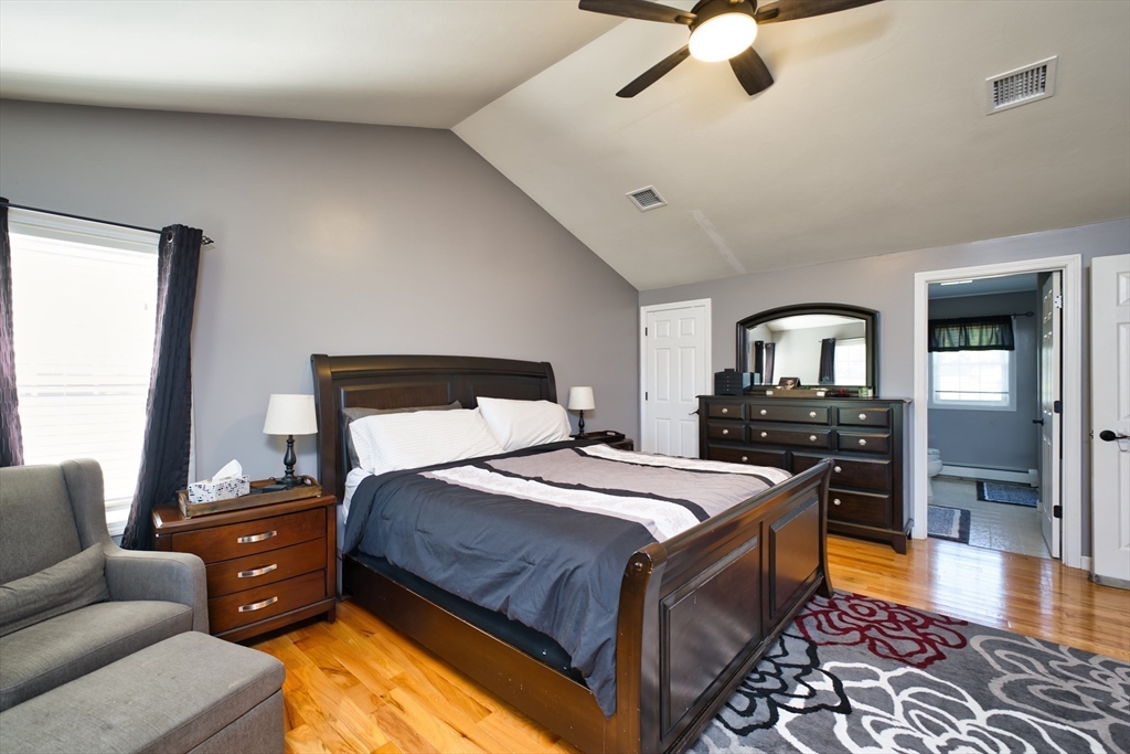 52 Pershing Avenue Acushnet, MA 02743 - Photo 14 of 27 a bedroom with a bed and wooden floor