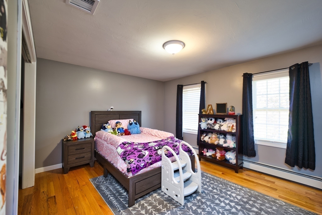 52 Pershing Avenue Acushnet, MA 02743 - Photo 17 of 27 a bedroom with a bed and a window