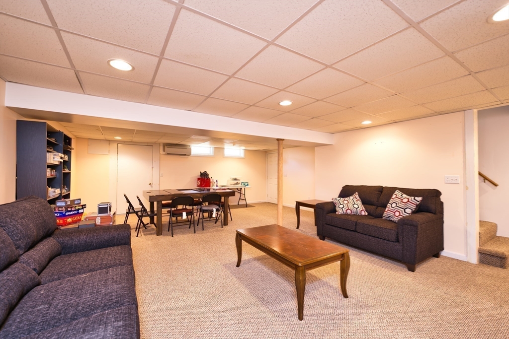 52 Pershing Avenue Acushnet, MA 02743 - Photo 20 of 27 a living room with furniture and a wooden floor