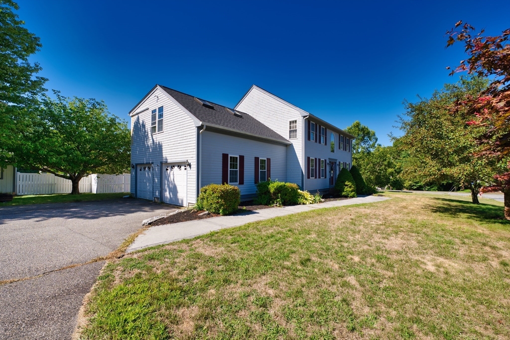 52 Pershing Avenue Acushnet, MA 02743 - Photo 4 of 27 a front view of a house with a yard