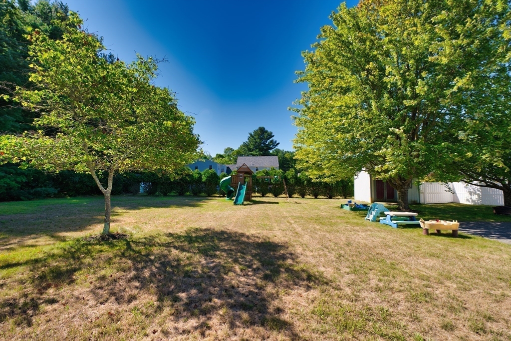 52 Pershing Avenue Acushnet, MA 02743 - Photo 5 of 27 a front view of a house with a yard and garage
