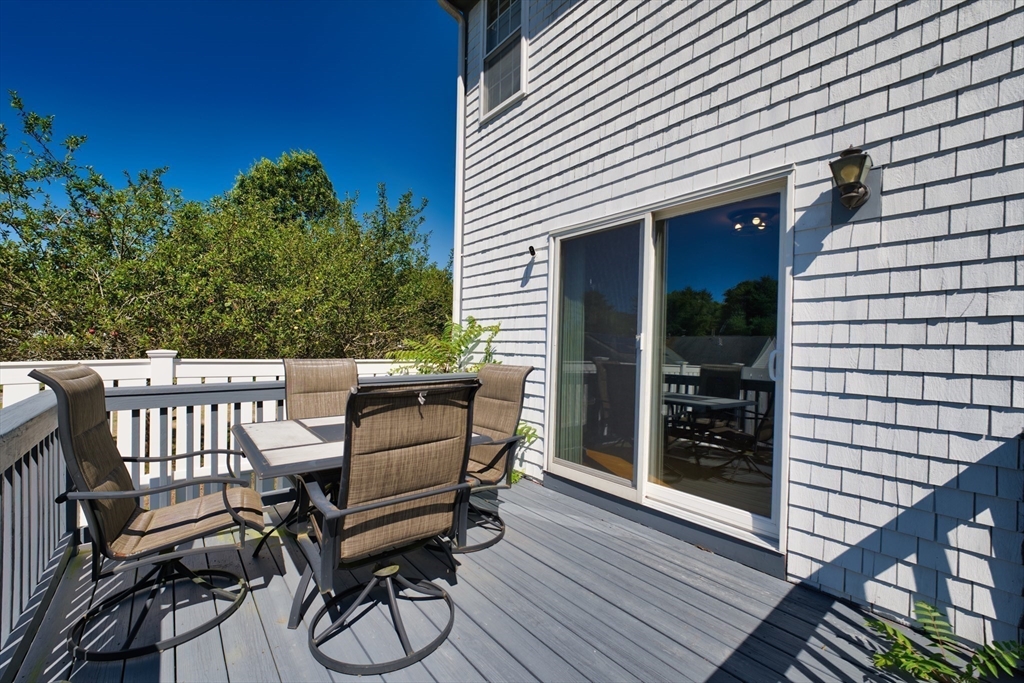 52 Pershing Avenue Acushnet, MA 02743 - Photo 6 of 27 a view of a chairs and table in the balcony