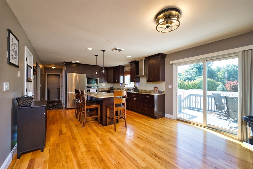 52 Pershing Avenue Acushnet, MA 02743 - Photo 9 of 27 a view of a dining room with furniture window and wooden floor