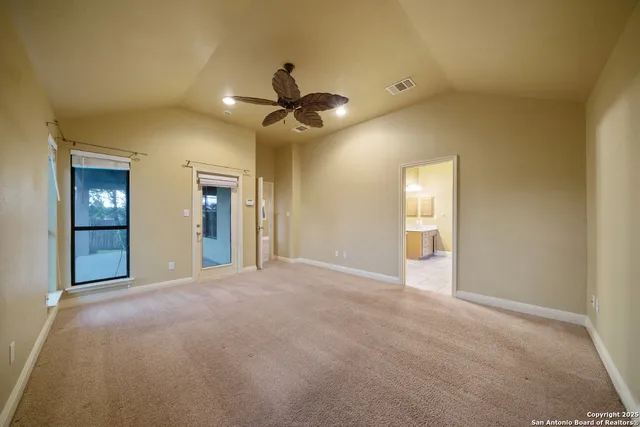 a view of empty room with windows