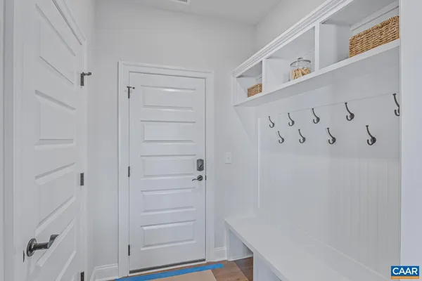 a view of an entryway with wooden floor