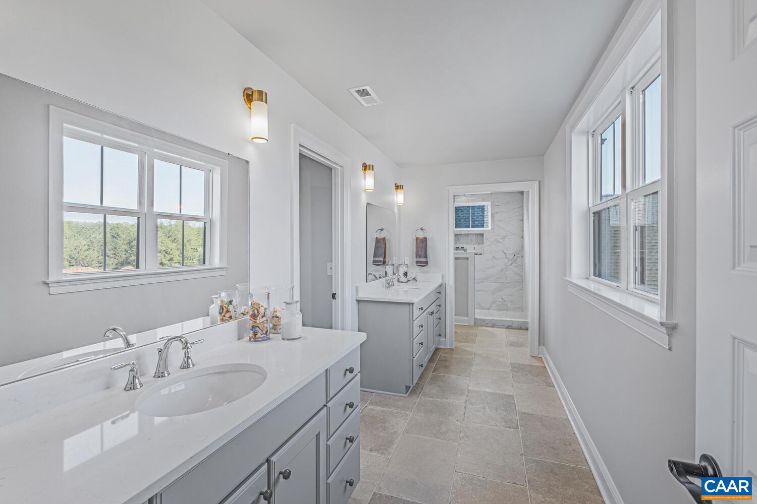 2 Agatha Ridge Lane Crozet, VA 22932 - Photo 24 of 42 a bathroom with a double vanity sink mirror and double
