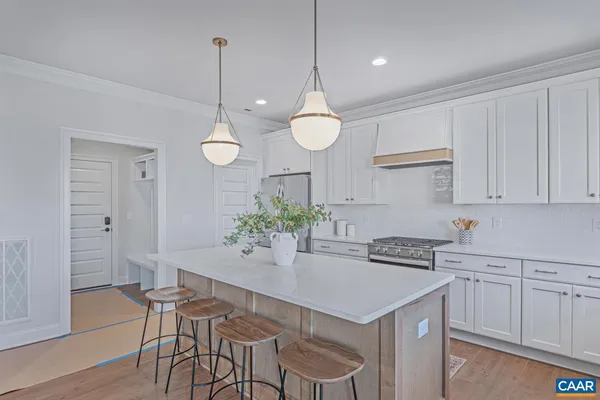 a kitchen with a table and chairs in it