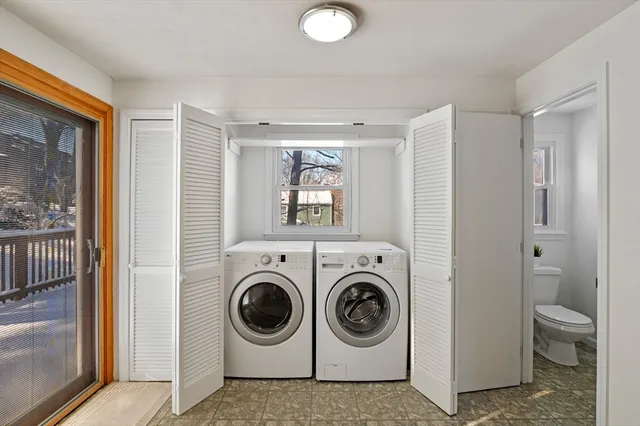 a bathroom with a sink a mirror and toilet