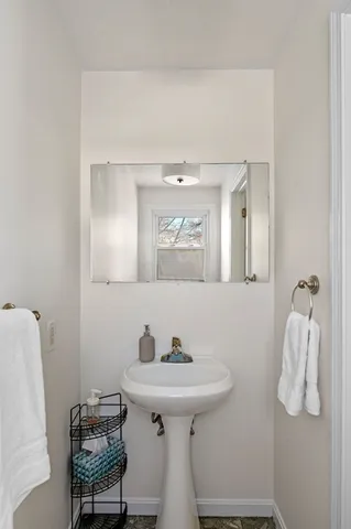 a view of a hallway with wooden floor and entryway