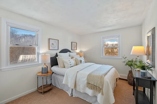 a bedroom with a bed and a mirror