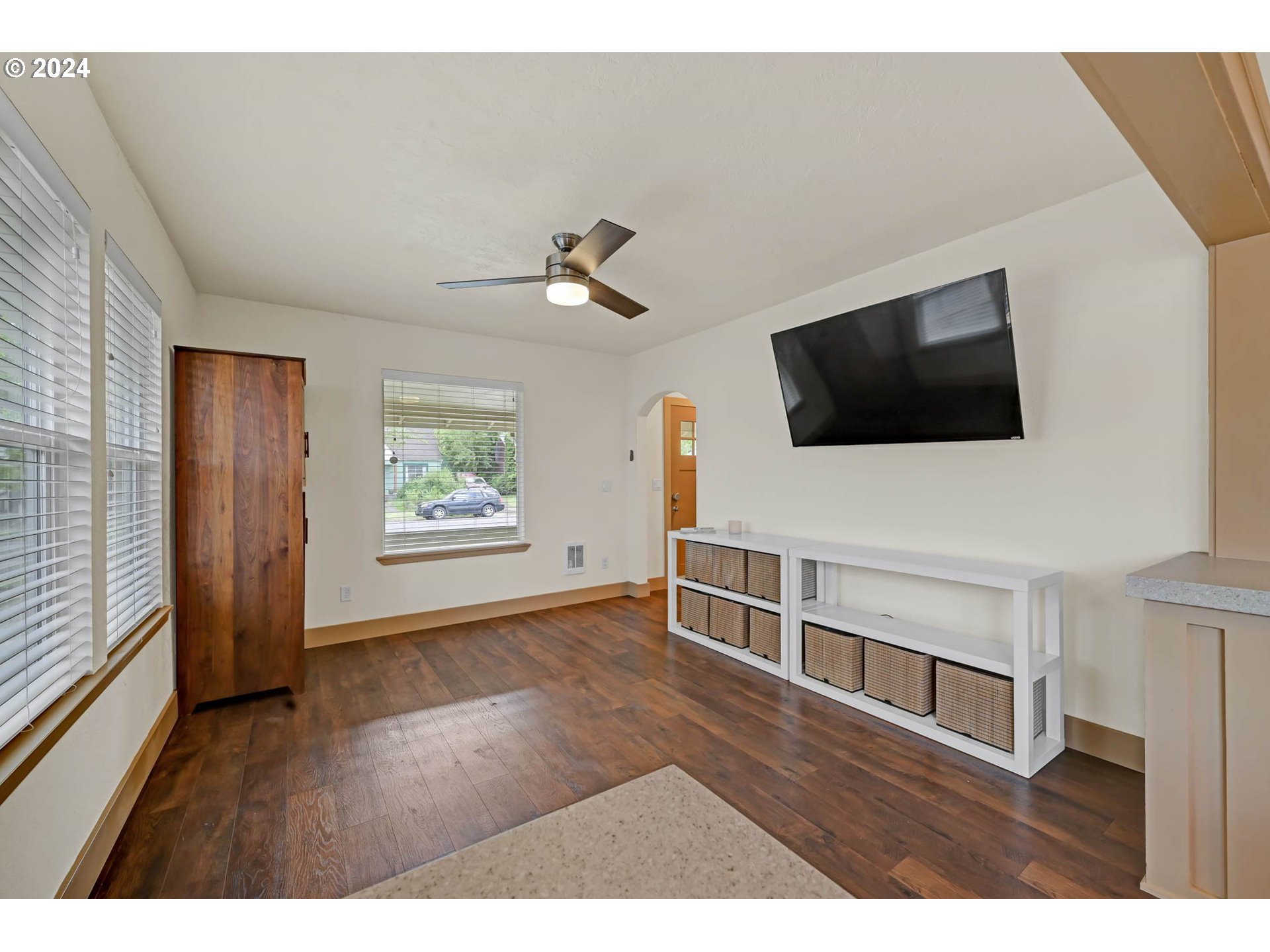 830 G Street Springfield, OR 97477 - Photo 11 of 38 a view of a livingroom with entryway and a flat screen tv