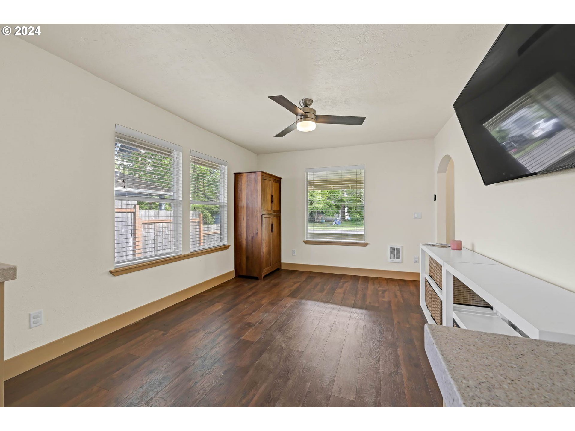 830 G Street Springfield, OR 97477 - Photo 19 of 38 a view of an empty room with a window and wooden floor