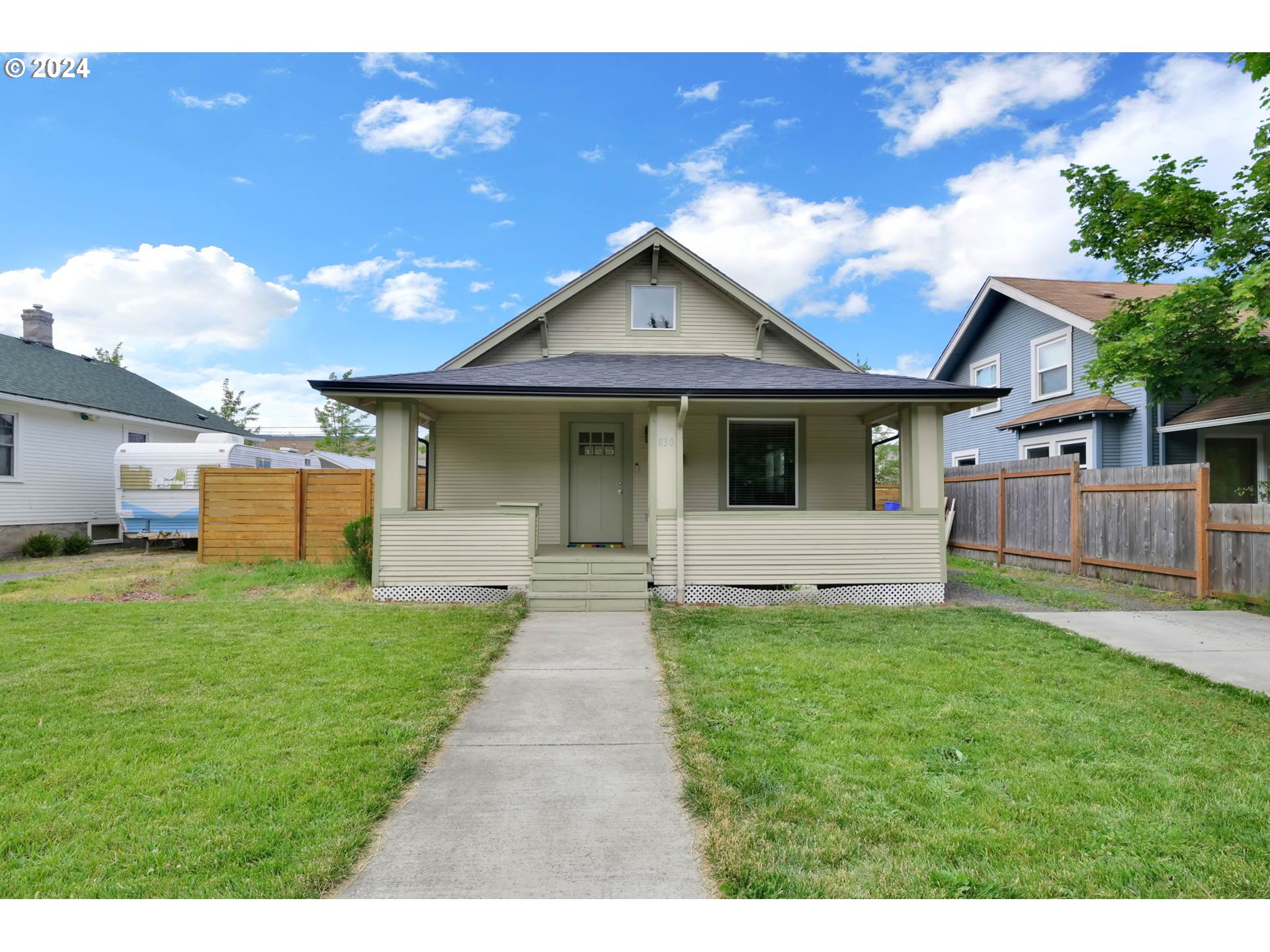 830 G Street Springfield, OR 97477 - Photo 2 of 38 a front view of a house with a yard and garage