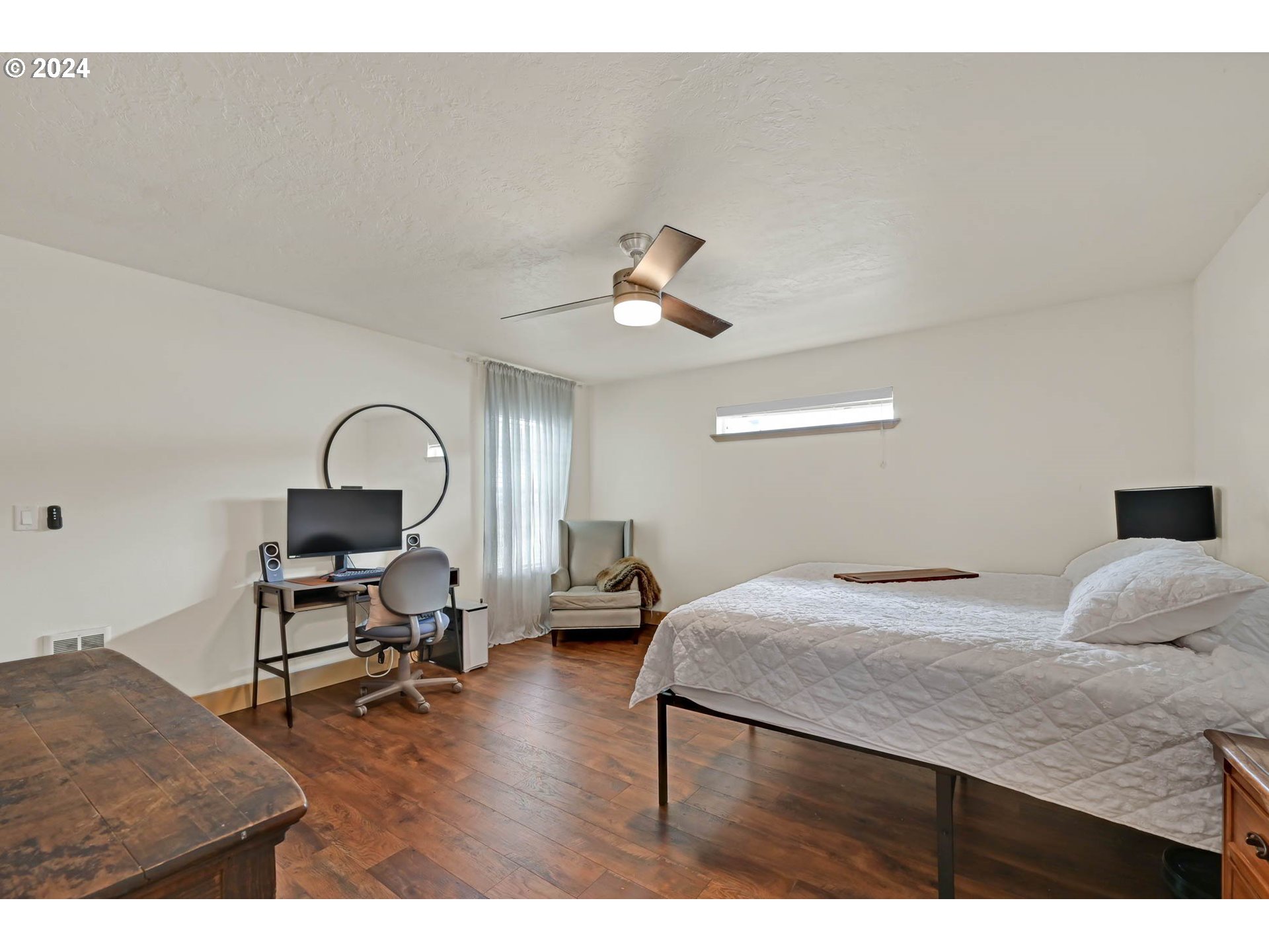 830 G Street Springfield, OR 97477 - Photo 24 of 38 a bedroom with a bed and a table