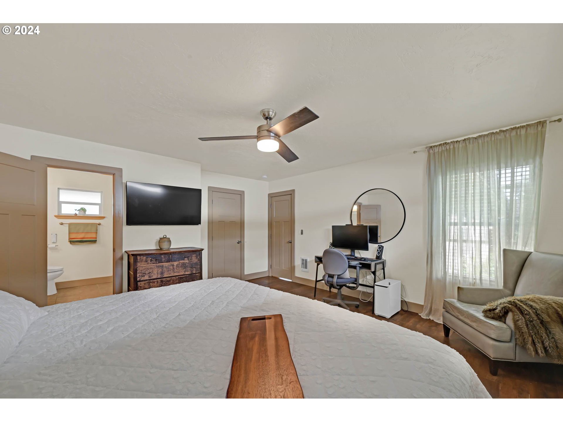 830 G Street Springfield, OR 97477 - Photo 27 of 38 a bedroom with a bed and a flat screen tv