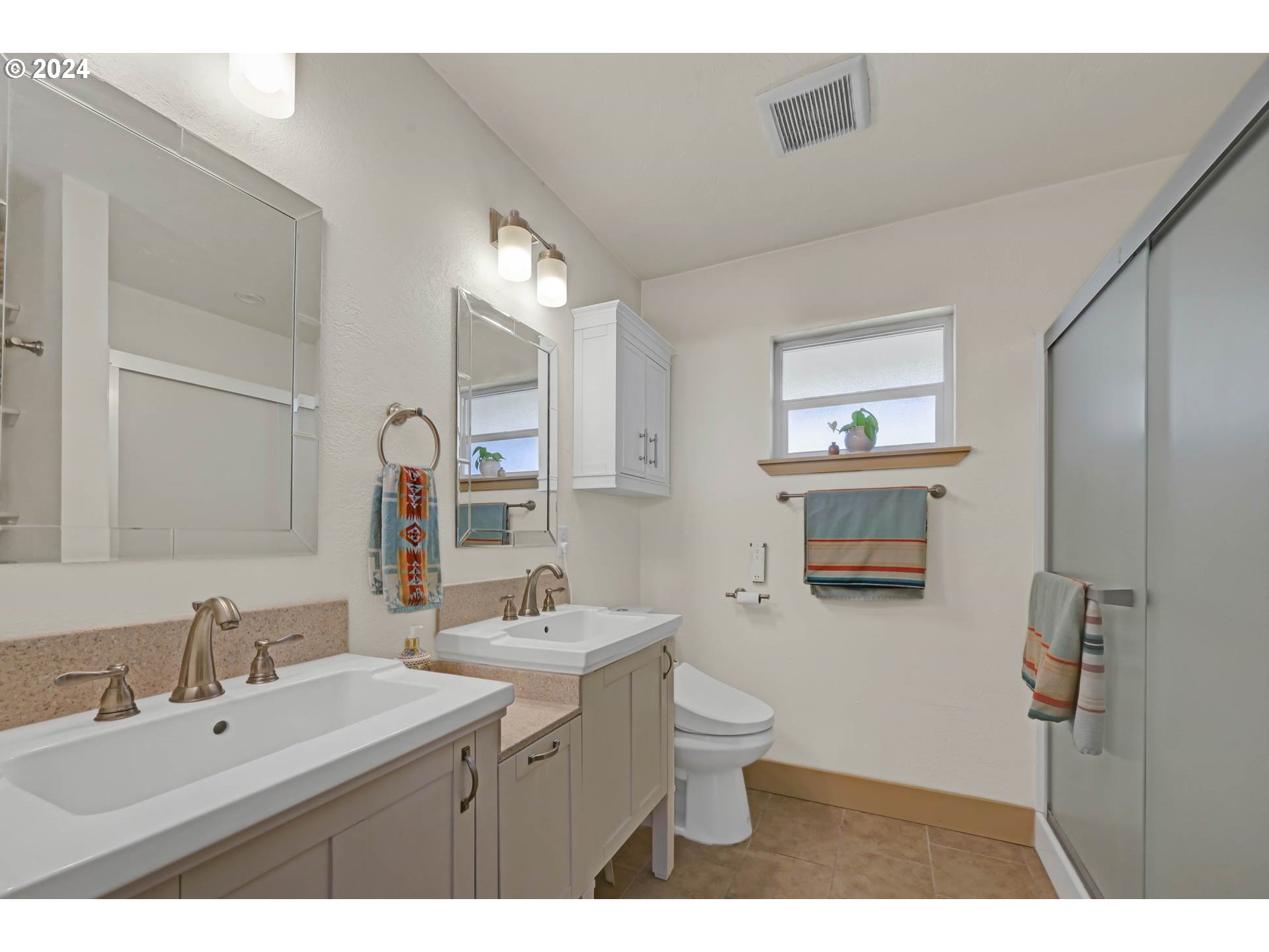 830 G Street Springfield, OR 97477 - Photo 31 of 38 a bathroom with a double vanity sink mirror and toilet