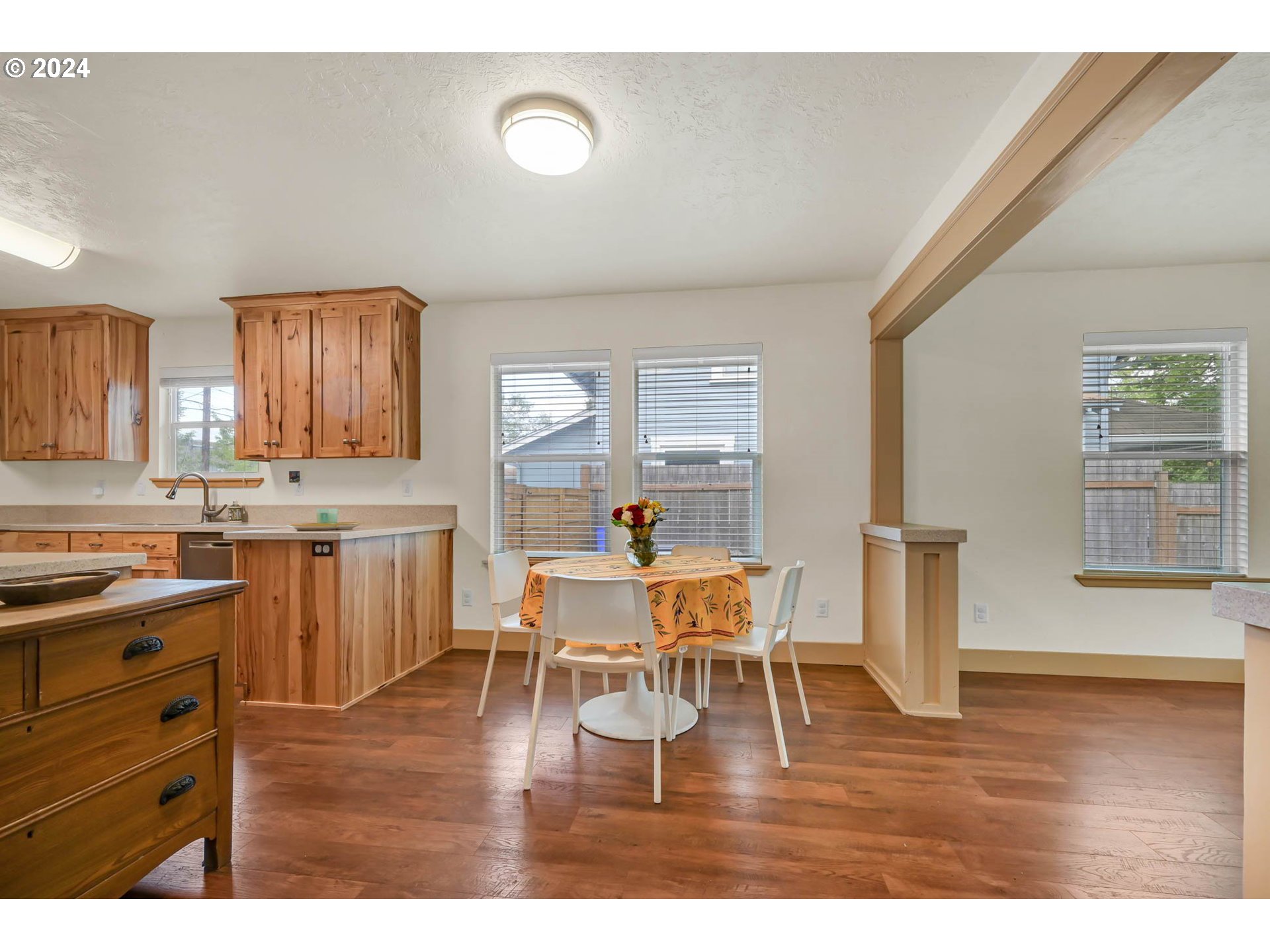 830 G Street Springfield, OR 97477 - Photo 7 of 38 a kitchen with a table chairs and wooden floor