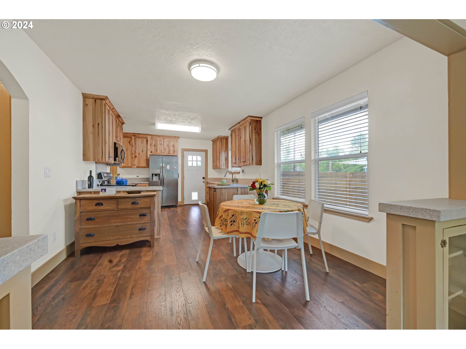 830 G Street Springfield, OR 97477 - Photo 9 of 38 a dining room with furniture and wooden floor