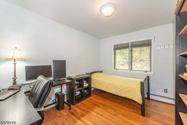 a bed room with a bed and a window