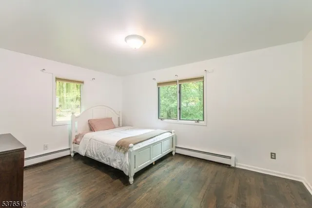 a room with a bed and a window