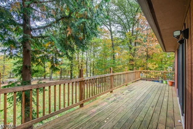 a view of balcony with wooden floor