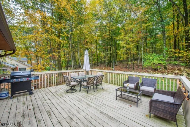 a view of sitting area with furniture in backyard