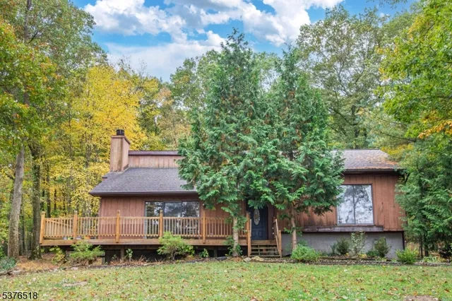 a view of a house with a tree