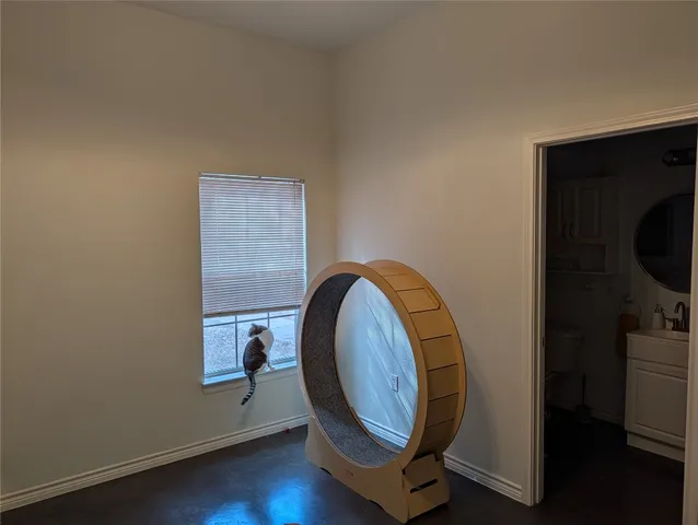 a very nice looking room with wooden floor and a window