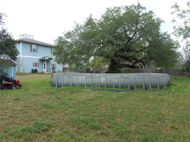 a view of a backyard with a swing