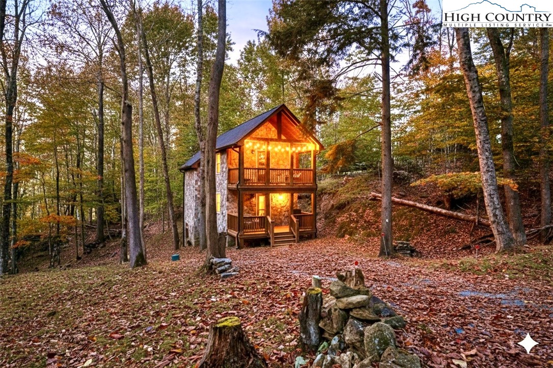 a backyard of a house with barbeque oven table and chairs