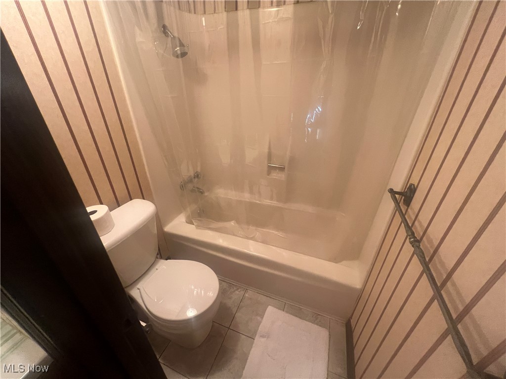 86301 North Bay Road Scio, OH 43988 - Photo 36 of 50 Bathroom with tile patterned floors, shower / bath combo, and toilet