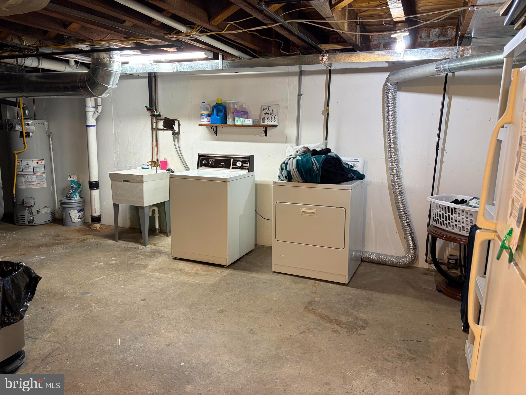 734 Primos Avenue Clifton Heights, PA 19018 - Photo 16 of 16 a utility room with a refrigerator and washer