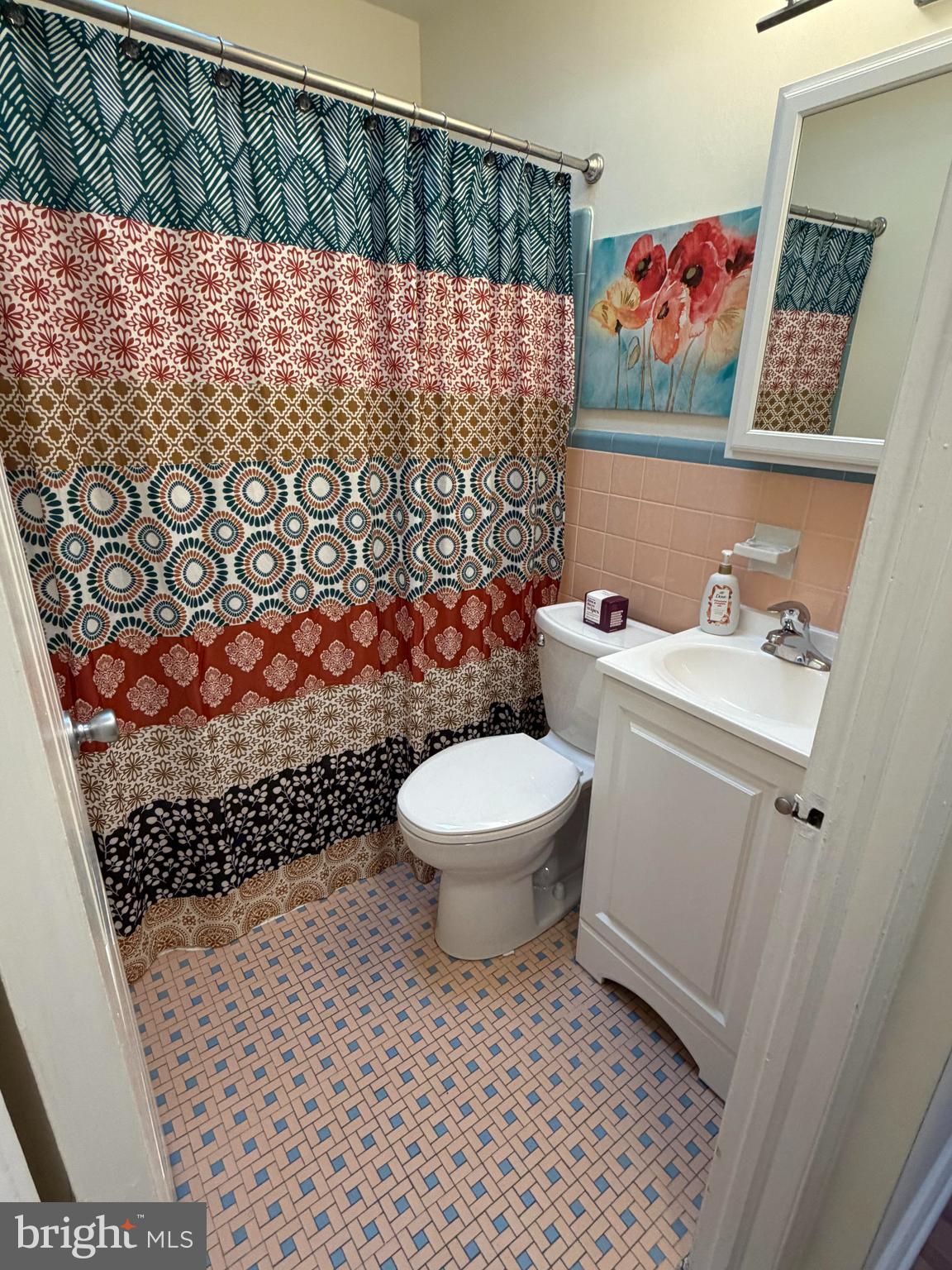 734 Primos Avenue Clifton Heights, PA 19018 - Photo 9 of 16 a bathroom with a toilet and a shower curtain