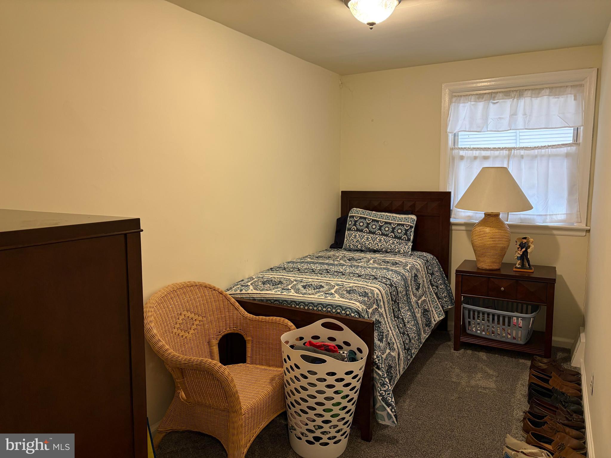 734 Primos Avenue Clifton Heights, PA 19018 - Photo 10 of 16 a bedroom with a bed and a lamp on table