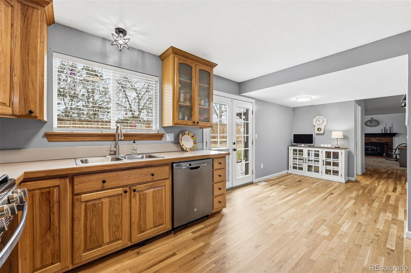 4993 East 111th Place Thornton, CO 80233 - Photo 16 of 50 a kitchen with stainless steel appliances granite countertop a sink and cabinets