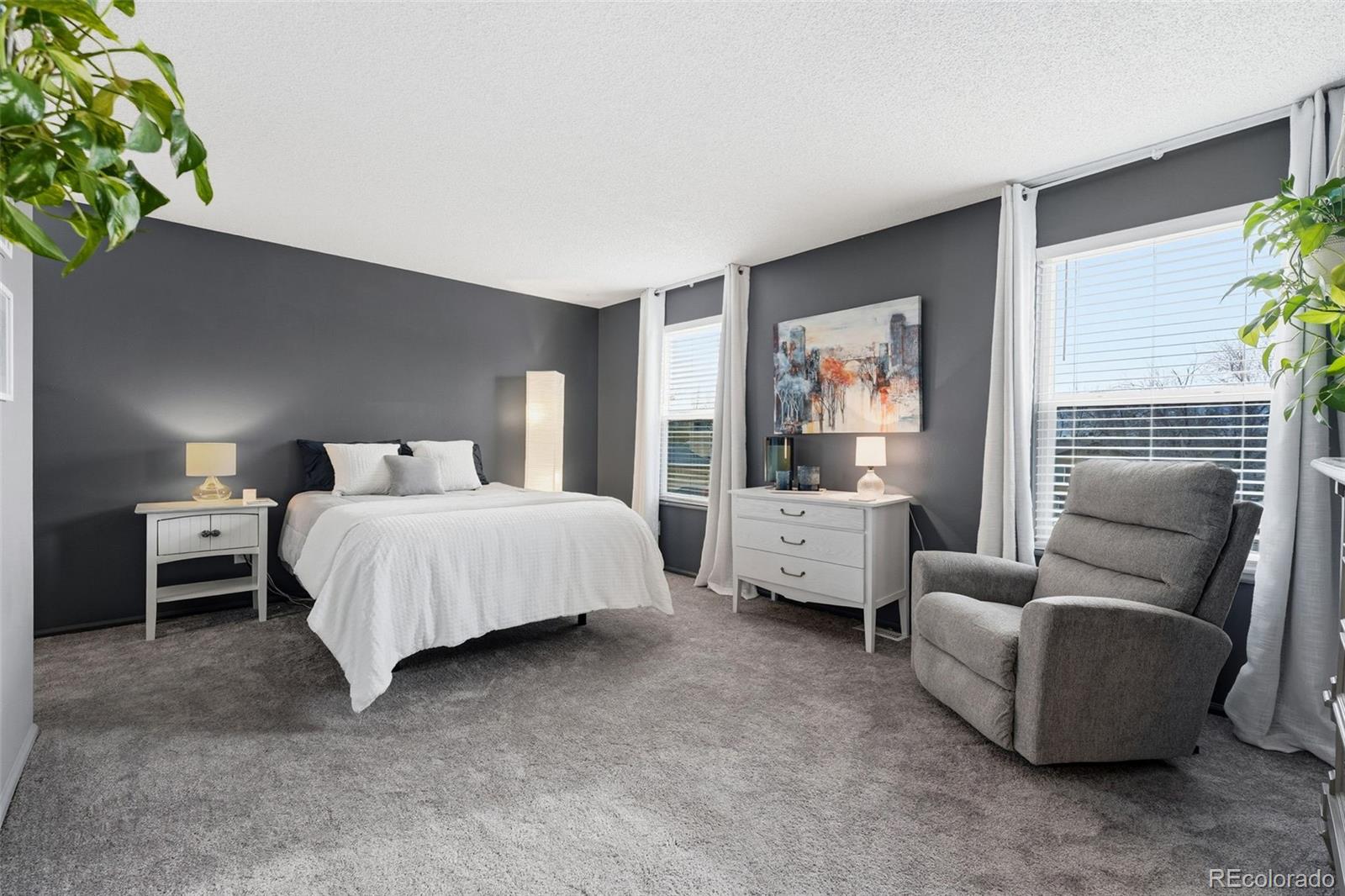 4993 East 111th Place Thornton, CO 80233 - Photo 22 of 50 a bedroom with a bed and a couch