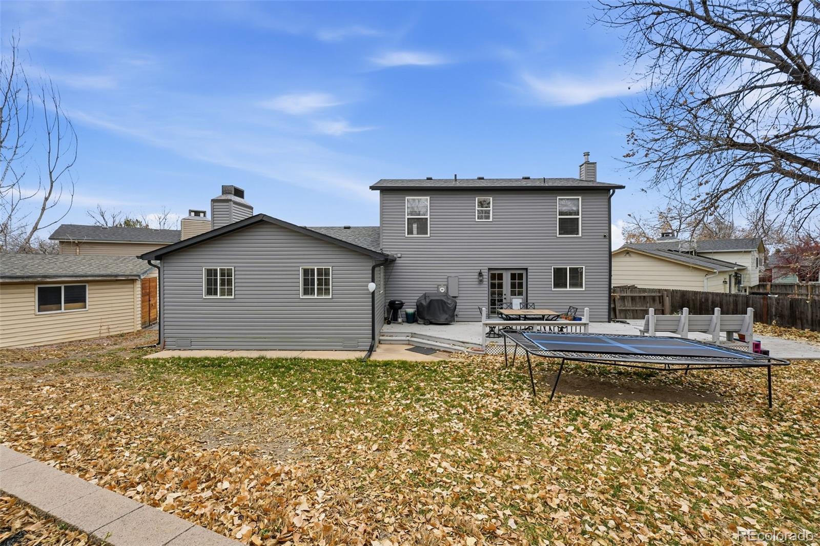 4993 East 111th Place Thornton, CO 80233 - Photo 41 of 50 a view of a house with pool and chairs